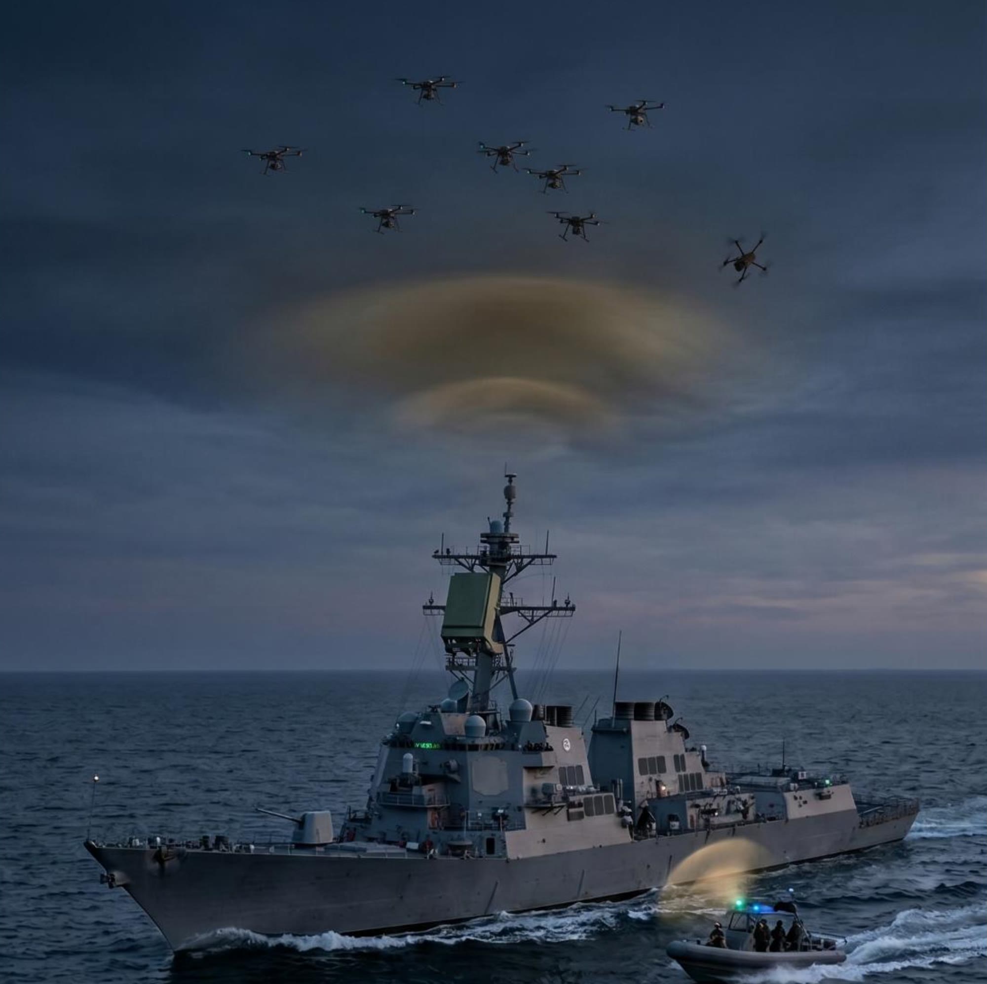 Un navire de guerre au crépuscule, sous un ciel où passent des drones.